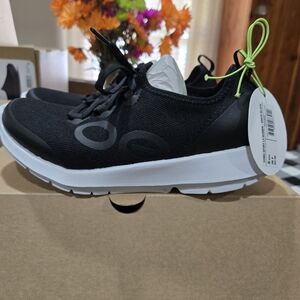 OOFOS Black and White Sneakers